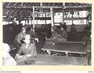 KERAVIA BAY, NEW BRITAIN. 1945-11-12. AN INTERIOR VIEW OF THE ROYAL NETHERLANDS EAST INDIES ARMY CAMP, WHERE SOME 150 ROYAL NETHERLANDS EAST INDIES EX-PRISONERS OF WAR ARE AWAITING MOVEMENT TO ..