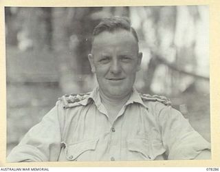 MALMAL VILLAGE, NEW BRITAIN. 1945-01-04. VX133197 CHAPLAIN F.T. BORLAND, 2/8TH AUSTRALIAN GENERAL HOSPITAL