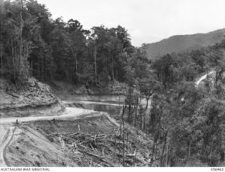 REINHOLD HIGHWAY, NEW GUINEA. 1943-08-24. PORTION OF THE MOUNTAIN ROAD CONSTRUCTED BY THE TROOPS OF HEADQUARTERS, ROYAL AUSTRALIAN ENGINEERS, 11TH AUSTRALIAN DIVISION BETWEEN JOHNSON'S GAP AND EDIE ..