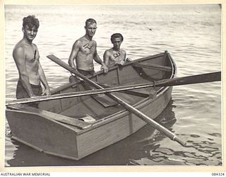 CUTARP PLANTATION, JACQUINOT BAY, NEW BRITAIN. 1944-12-15. PRIVATE J A PASHLEY, (1); CORPORAL A J BIGGINS, (2); AND PTE J S HUGHES, (3); ALONGSIDE A SHARPIE TYPE BOAT BUILT BY 14/32 INFANTRY ..