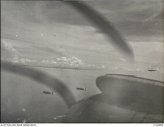 BISMARCK ARCHIPELAGO. 1944-03-28. AIRCRAFT, CODE NAMED UP-T, UP-S, UP-C AND UP-W, OF NO. 79 (SPITFIRE) SQUADRON RAAF, IN FLIGHT OVER NEW BRITAIN EN ROUTE FROM KIRIWINA TO THE ADMIRALTY ISLANDS. ..