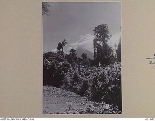 TOROKINA, BOUGAINVILLE, 1945-05-05. DISTANT VIEW OF MT BAGANA, AN ACTIVE VOLCANO ON THE ISLAND 3 MILITARY HISTORY FIELD TEAM IS OPERATING IN THE AREA