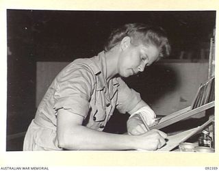 LAE, NEW GUINEA, 1945-05-23. PRIVATE J. RICHARDS, AWAS, AT NO 1 SUB DEPOT, 4 ADVANCED ORDNANCE DEPOT, CHECKING ACCOUNT CARDS. AWAS PERSONNEL ARE AT LAE TO RELEASE MEN OF HQ FIRST ARMY FOR DUTY IN ..