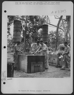 Somwhere In The Solomom Islands, Men Enjoy Cleaning Their Mess Kits In This Emprovised "Mess Kit Laundry" Made From Discarded Fuel Drums Encased On Concrete And Connected To Running Water With An Adequate Drainage System. Note The Chimneys, Also, Made Fro (U.S. Air Force Number 68479AC)