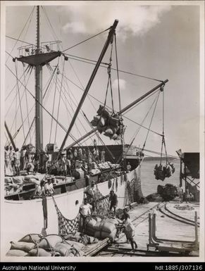 Loading sugar bags onto ships