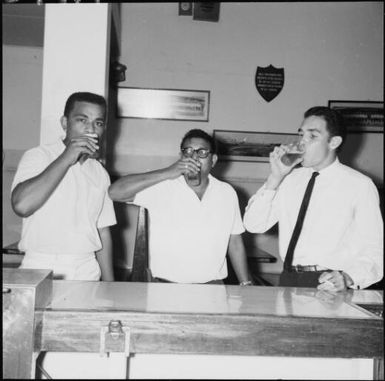 F. Jozefa Raithadroka, I. Pete Prasad, and E. Marie McDonald at a pub, Fiji, 1966 / Michael Terry