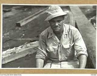 LAE, NEW GUINEA, 1943-11-05. ASN-O-920748 SECOND LIEUTENANT F.M. MABERRY, OFFICER IN CHARGE OF THE 1052ND ENGINEERS PORT CONSTRUCTION AND REPAIR GROUP, UNITED STATES ARMY