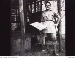 MILNE BAY, PAPUA, C.1942. LEADING AIRCRAFTMAN NICK SIMPSON, THE COOK AT NO. 37 RAAF RADAR STATION. (DONOR - T.G. JONES)