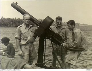 Goodenough Island, New Guinea. 1942-09-09. An anti-aircraft gun crew aboard the launch Maclaren King who helped to beat off an attack by Japanese aircraft. The three members of the crew are, from ..