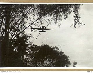 NEW GUINEA, 1943-08-01. "KAI" OR "BISCUIT" BOMBERS WERE USED TO CARRY SUPPLIES OF FOOD AND AMMUNITION TO FORWARD TROOPS IN INACCESSIBLE AREAS. NOTE - KAI IS THE NATIVE WORD FOR FOOD. PHOTOGRAPH ..