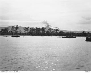 TOROKINA, BOUGAINVILLE, 1945-07-04. MOUNT BAGANA, AN ACTIVE VOLCANO IN 3 DIVISION AREA ON BOUGAINVILLE ISLAND, VIEWED FROM A SHIP IN THE HARBOUR