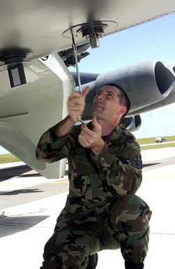 US Air Force (USAF) STAFF Sergeant (SSGT) Derek Bussard, Electronic Counter Measures Element CHIEF, assigned to the 2nd Bomb Wing (BW) performs routine maintenance on a USAF B-52H Stratofortress aircraft while deployed with the 7th Air Expeditionary Wing (AEW) at Andersen Air Force Base (AFB), Guam, during Operation, ENDURING FREEDOM