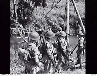 SOGERI VALLEY, NEW GUINEA. 1943-06-28. THE 7TH AUSTRALIAN INFANTRY BRIGADE SET UP THE DONADABU TRAINING CAMP DURING WORLD WAR 2 OF 1939-1945. A TRAINING PATROL FROM "B" COMPANY, 25TH BATTALION, 7TH ..