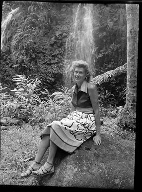 Paulette, sitting by waterfall, Tahiti