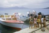 Federated States of Micronesia, group of children welcoming tourists at waterfront in Chuuk State