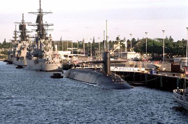 The nuclear-powered strategic missile submarine USS GEORGIA (SSBN-728), the guided missile cruiser USS WORDEN (CG-18) and the guided missile cruiser USS HORNE (CG-30) are moored to a pier