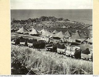 GUSIKA, NEW GUINEA. 1944-04-09. A SECTION OF A UNITED STATES ARMY CAMP CONTAINING HUNDREDS OF TENTS, VIEWED FROM HALF WAY UP THE GUSIKA HILL