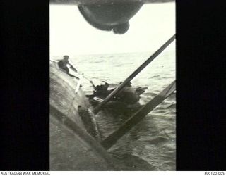 NEAR WEWAK, NEW GUINEA 1944-11-10. AN RAAF CATALINA RESCUING 5 AMERICAN AIRMEN OF 5TH BOMBER COMMAND COMBAT REPLACEMENT AND TRAINING CENTRE B25 WHICH WAS DOWNED FOUR MILES FROM CAPE WOM. THE ..