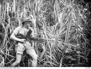 AUSTRALIAN JOHN HANNAM HANDLES A BREN GUN