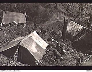 REINHOLD HIGHWAY, NEW GUINEA, 1943-08-24. ROADSIDE CAMP SITE OF HEADQUARTERS, ROYAL AUSTRALIAN ENGINEERS, 11TH AUSTRALIAN DIVISION, EIGHT MILES SOUTH OF EDIE CREEK