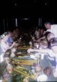 French Polynesia, tourists eating meal at resort on Moorea Island