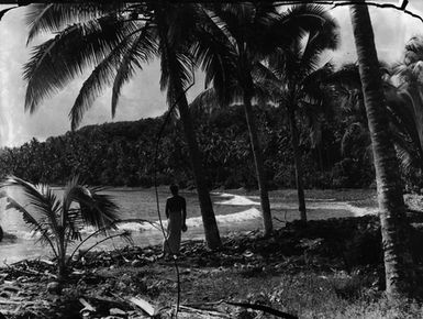 [Man on Pacific Island beach]