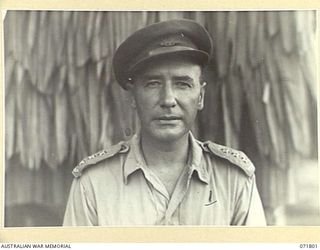 PORT MORESBY, PAPUA, NEW GUINEA, 1 APRIL 1944. INFORMAL PORTRAIT OF SX22297 CAPTAIN D. R. DOWNEY, GSO III, (LIAISON), INTELLIGENCE, HEADQUARTERS NEW GUINEA FORCE