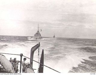 NAVY PERSONNEL BEING TRANSFERRED FROM HMAS NORMAN TO HMAS NAPIER. THE TWO AUSTRALIAN DESTROYERS WERE PART OF THE BRITISH FLEET EN ROUTE TO OPERATIONS OFF JAPAN