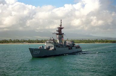 The frigate USS MEYERKORD (FF-1058) departs from the naval station.