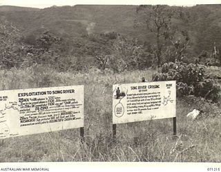 FINSCHHAFEN AREA, NEW GUINEA, 1944-03-17. TWO OF MANY BATTLE SIGNS IN THE FINSCHHAFEN AREA, THESE SIGNS RECORD ACTIVITIES OF THE 2/23RD INFANTRY BATTALION ASSISTED BY THE 2/4TH CAVALRY (COMMANDO) ..