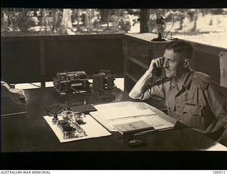 New Guinea. 1944-06-17. An informal portrait of Brigadier B. W. Pulver, Deputy Adjutant and Quartermaster-General, Headquarters, New Guinea Force, working in his office