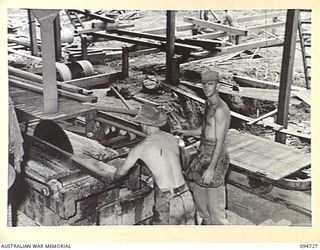 YALU AREA, NEW GUINEA, 1945-07-30. PERSONNEL OPERATING NO. 1 BENCH, 2/1 FORESTRY COMPANY, ROYAL AUSTRALIAN ENGINEERS, PHOTOGRAPHED AT THE REQUEST OF THE COMMANDING OFFICER