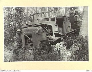 HANSA BAY, NEW GUINEA. 1944-06-17. A POWERFUL CATERPILLAR TRACTOR ABANDONED BY THE JAPANESE DURING THEIR RETREAT IN THE AREA