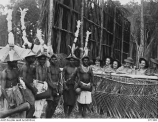 SONG RIVER, FINSCHHAFEN AREA, NEW GUINEA. 1944-03-26. MEMBERS OF THE AUSTRALIAN ARMY NURSING SERVICE ATTACHED TO THE 2/3RD AND 106TH CASUALTY CLEARING STATION VIEWING A SING-SING HELD AT THE ..