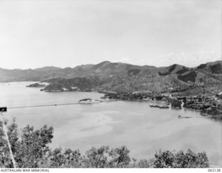 PORT MORESBY AREA, NEW GUINEA. 1943-12-29. VIEW FROM THE TUA-GUBA HILL SHOWING THE PANORAMA FROM THE ROYAL AUSTRALIAN AIR FORCE HEADQUARTERS, GENERAL HEADQUARTERS AND THE UNITED STATES NAVY ..