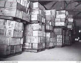 GAYTHORNE, QLD. 1946-04-11. BOXES OF CLOTHING CLOTHING RECEIVED FROM NEW GUINEA AWAITING CLASSIFICATION AND REPACKING ARE STORED AT STOREHOUSE NO. 2, 7TH BASE ORDNANCE DEPOT