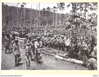 MUSCHU ISLAND, NEW GUINEA. 1945-09-24. MAJOR GENERAL H.C.H. ROBERTSON, GENERAL OFFICER COMMANDING 6 DIVISION INSPECTING A PARADE AT THE HEADQUARTERS OF LIEUTENANT GENERAL K. YOSHIWARA, CHIEF OF ..