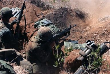 Members of Company A, 1ST Battalion, 19th Infantry, 25th Infantry Division, fire M16A1 rifles on targets at the Pohakuloa Training Area during Exercise OPPORTUNE JOURNEY 4-84