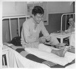 Pfc. Kiyashi Yonemori at the Moore General Hospital, Swannanoa, North Carolina, reads a letter from home. With the 100th Battalion