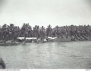 SEGI AREA, NEW GEORGIA, BRITISH SOLOMON ISLANDS PROTECTORATE. AN INTELLIGENCE PATROL ABOUT TO SET OUT FROM THE COASTWATCHER STATION. THE STOCKADE AT RIGHT CENTRE ENCLOSES A BATHING POOL FOR ..