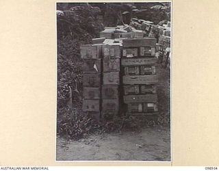 RABAUL, NEW BRITAIN. 1945-11-20. TYPES OF PACKING CASES USED FOR JAPANESE NAVAL SHELLS, NOW STORED IN 11 DIVISION AREA