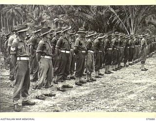 FINSCHHAFEN, NEW GUINEA, 1944-02-29. TROOPS OF THE 2/17TH INFANTRY BATTALION ATTENDING THE OFFICIAL OPENING OF THE FINSCHHAFEN WAR CEMETERY BY VX20308 MAJOR-GENERAL F.H. BERRYMAN, CBE, DSO, OFFICER ..