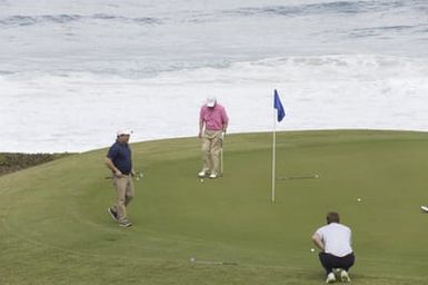 Barack Obama plays golf with Prime Minister Najib Razak, Joe Paulsen, and Mike Brush in Kaneohe Bay, Hawaii, December 24, 2014