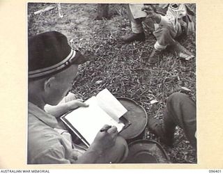 MUSCHU ISLAND, NEW GUINEA, 1945-09-11. FOLLOWING THE SURRENDER OF THE JAPANESE, MUSCHU ISLAND IS NOW UNDER THE CONTROL OF HQ 6 DIVISION. THIS PHOTOGRAPH SHOWS PAYMASTER FUJIHIRA OF THE JAPANESE ..