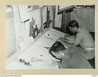 LAE, NEW GUINEA. 1944-11-11. PATIENTS WORKING IN THE HOBBIES HUT AT THE 112TH CONVALESCENT DEPOT. IDENTIFIED PERSONNEL ARE: V335596 GUNNER W. THOMSON, 4TH FIELD REGIMENT (1), V503581 SIGNALLER L.H. ..