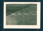 View of houses, mountain in background, New Guinea, c1929 to 1932