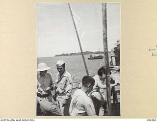 SORAKEN PENINSULA, BOUGAINVILLE. 1945-09-14. A MOTOR LAUNCH CARRYING MEMBERS OF HEADQUARTERS 2 CORPS, PREPARED FOR SURRENDER DISCUSSIONS WITH THE JAPANESE AT A SEA RENDEZVOUS OFF SORAKEN PENINSULA, ..