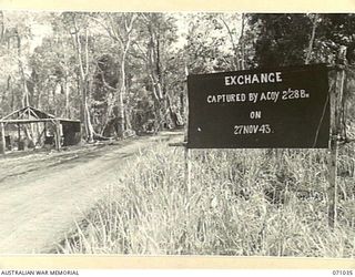 EXCHANGE, NEW GUINEA. 1944-03-13. ONE OF MANY BATTLE SIGNS IN THE FINSCHHAFEN AREA, THIS SIGN RECORDS ACTIVITIES OF "A" COMPANY, 2/28TH INFANTRY BATTALION