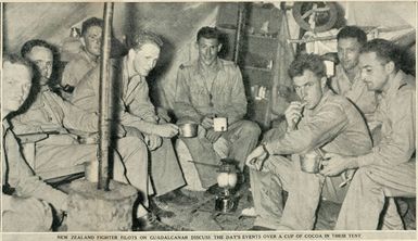 New Zealand fighter pilots on Guadalcanal discuss the day's events over a cup of cocoa in their tent