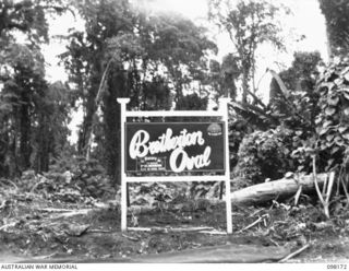 TOROKINA, BOUGAINVILLE. 1945-10-20. THE SIGN ON THE SPORTS GROUND AT HEADQUARTERS 3 DIVISION, NAMED IN MEMORY OF PRIVATE E.C. BRETHERTON, 24 INFANTRY BATTALION, A FORMER STAR FOOTBALLER FOR THE ..